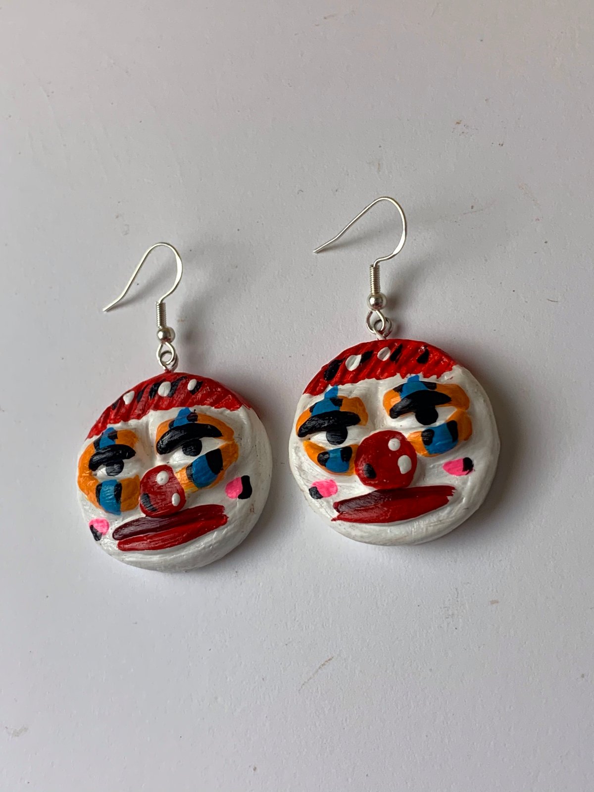 CLOWNIN\u2019 AROUND TOWN hand painted mismatched clown earrings